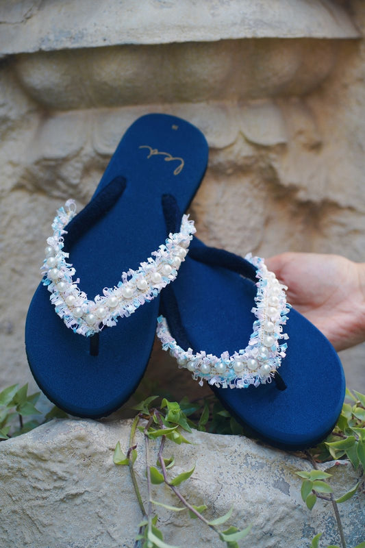 WHITE PEARLS IN DARK BLUE